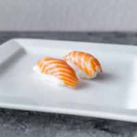 Sake Nigiri · 2 pieces of fresh salmon with sushi rice under. 