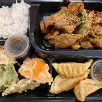 Teriyaki Chicken Bento Box · Teriyaki chicken, Served with steamed rice, vegetable tempura, 3 pcs chicken gyoza.