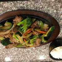 Beef Stir-fry Vegetable · Tender beef stir-fry with broccoli, zucchini, carrots, onions. Sever with steamed rice.
