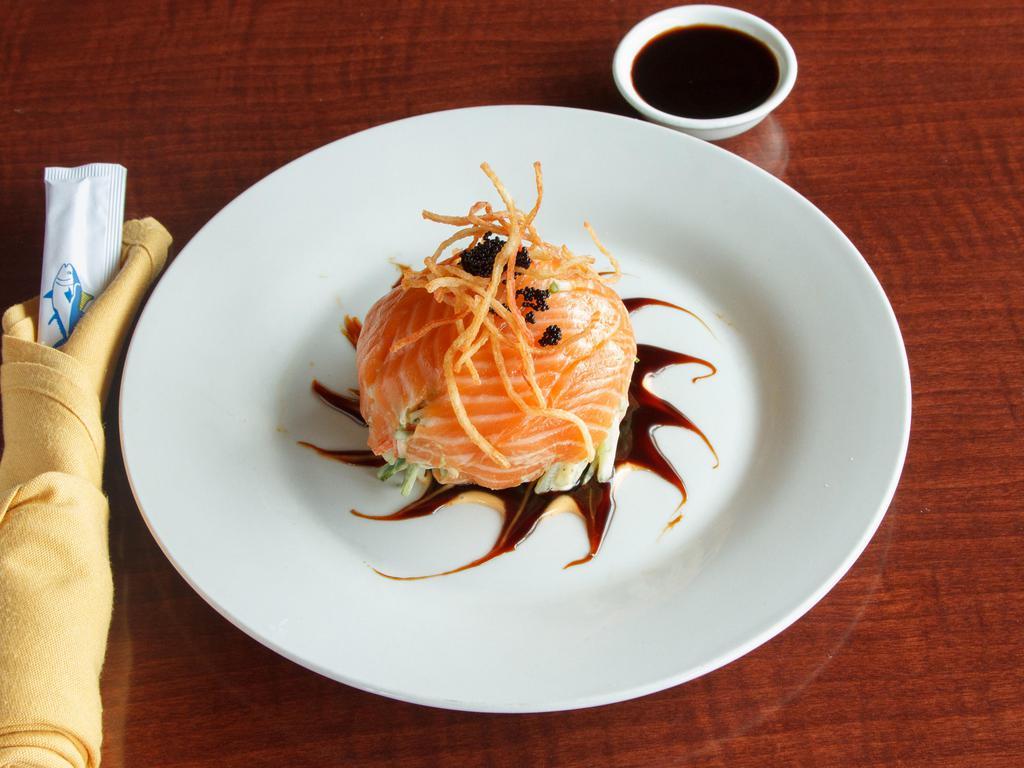 Salmon Avocado Salad · Crabmeat, avocado and cucumber mixed with spicy mayo, wrapped in thinly sliced fresh salmon and with tobiko on the top.