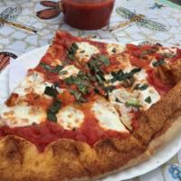 Caprese Pizza · Margherita!! topped with fresh mozzarella, Romano and fresh basil.