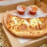 Calzone · Come with ham, ricotta and mozzarella cheese. Served with sauce on the side.