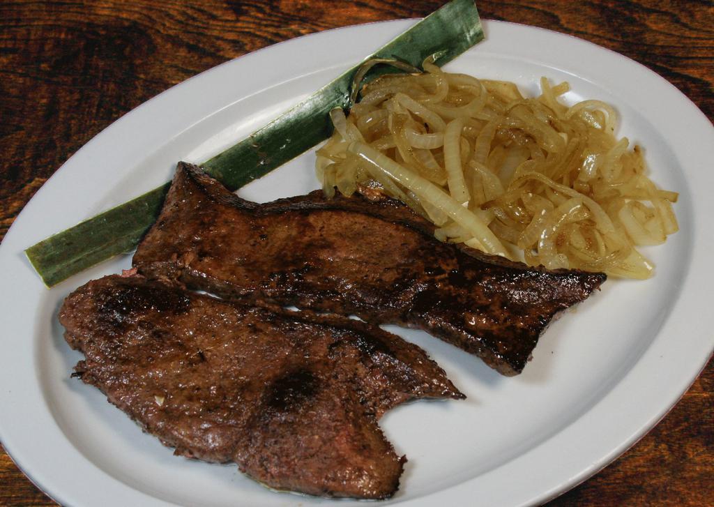 Higado a la Plancha · Grilled liver steak.