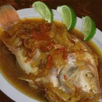Mojarra en Salsa · Whole red Tilapia cooked in our hogao Colombian sauce made of tomatoes and onions.