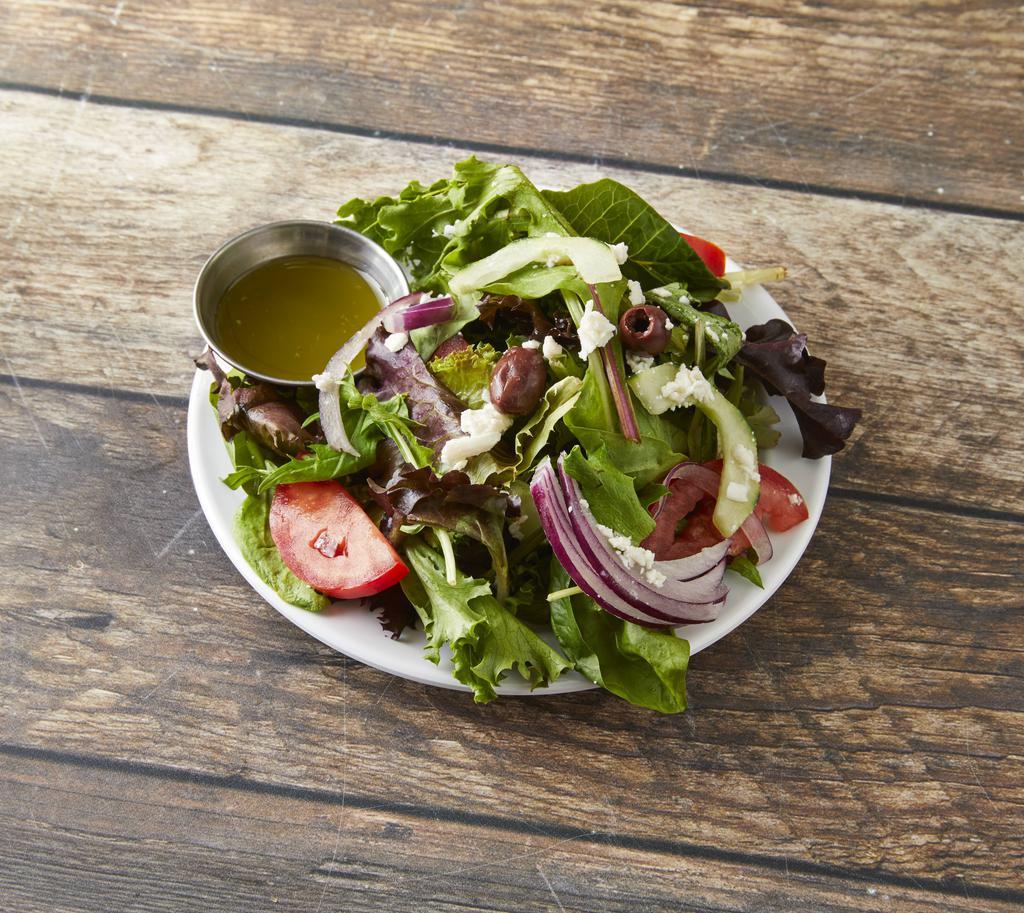 House Salad · Mixed greens, cucumbers, tomatoes, grilled vegetables, red onions and feta cheese with preserved lemon vinaigrette. Vegetarian.