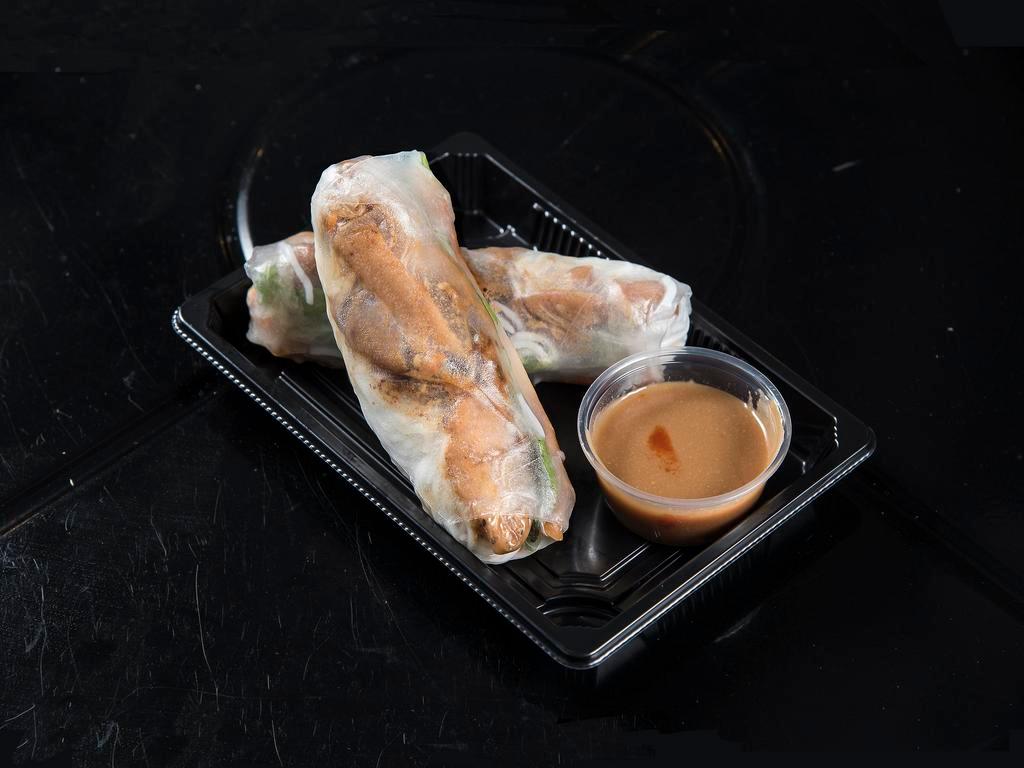 Chicken Spring Roll · Grilled chicken, rice noodles, daikon, carrots, cucumber, crunchy and lettuce.
