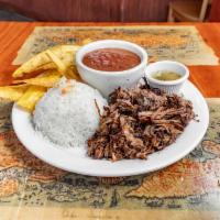 Lechon Asado  · Cuban style roasted pork and sauteed with mojo and onions. 