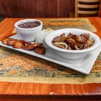 Masas Fritas  · Fried pork chunks with Cuban mojo and onions. 