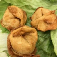 Crab Puffs · Crab meat and cream cheese in wonton skin.