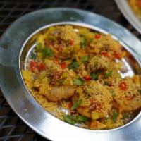 Sev Puri Chaat · 6 small puri topped with spiced potatoes, red onions, tomatoes, chaat masala, lemon juice, r...
