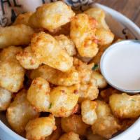 Beer Battered Cheese Curds · Spicy honey glaze.