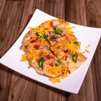 Nachos · Traditional nachos topped with your choice of beans, shredded chicken, taco meat or just mel...