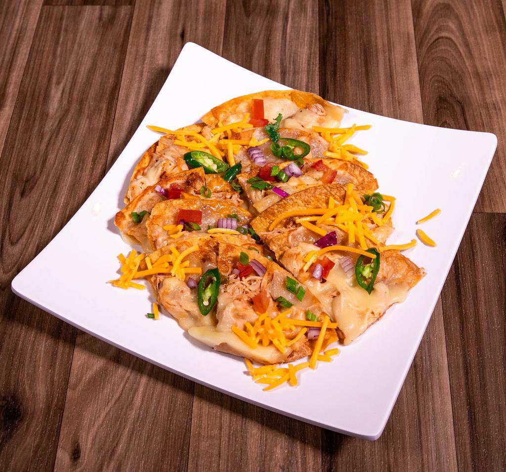 Nachos · Traditional nachos topped with your choice of beans, shredded chicken, taco meat or just melted Jack or cheddar cheese, served with jalapenos.