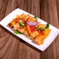 Flautas · 2 chicken flautas rolled in corn tortillas fried and lightly topped with ranchero sauce or c...