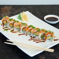 Torched Salmon Maki · Tobiko, cucumber, tempura crumb and spicy mayo topped with torched salmon, eel sauce and reg...