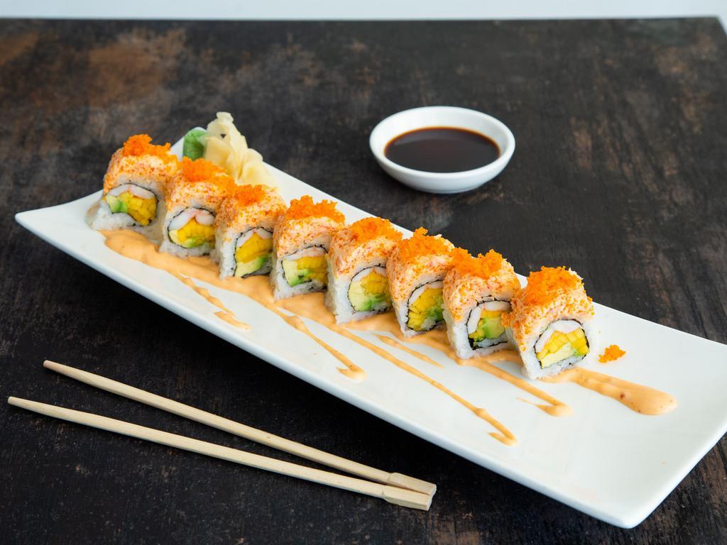 Snow Mountain Maki · Cooked shrimp, avocado and mango topped with a layer of spicy snow crab and tobiko.