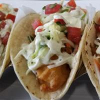 Fish Tacos Platter · Lightly battered baja style fish tacos served on a warm, five-inch corn tortilla with pico d...