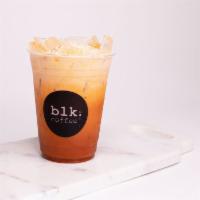 Iced Thai Tea · Black Thai tea leaves brewed for hours topped with breve milk over ice.