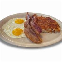 Norma’s Cafe Favorite · 2 eggs, any style, with your choice of ham, bacon or sausage. Served with hash browns or gri...