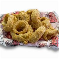 Onion Rings · Norma’s Cafe 1/2 pound of hand-battered onion rings made the old-fashioned way and fried gol...