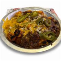 Chili Cheese Tots or Fries · Tater tots or fries smothered in Texas Cafe Chili topped with diced onions, jalapenos and me...