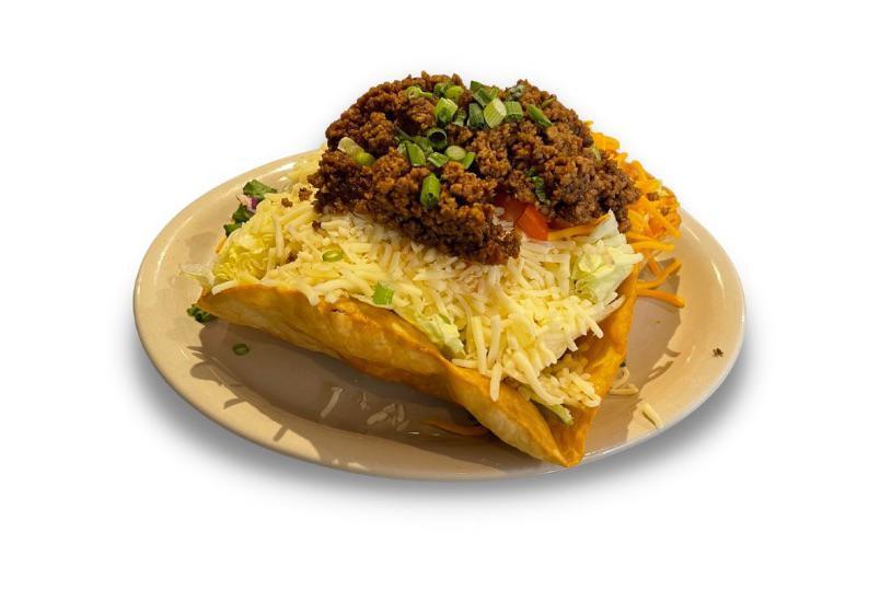 Taco Salad  · Seasoned ground beef over mixed greens with diced tomatoes, green onions, and topped with shredded Jack and cheddar cheeses. Served in a crisp taco shell with your choice of dressing on the side. 