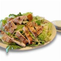 Grilled Chicken Caesar Salad  · Grilled chicken breast over crisp romaine lettuce, mixed with Parmesan cheese, croutons and ...