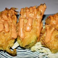 Stuffed Jalapeno · 6 pieces. Deep fried jalapeno stuffed with spicy crab meat and cream cheese. Served with spi...