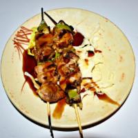 Chicken Yaki Tori · 2 pieces. Grilled chicken and vegetables on skewers with teriyaki sauce.
