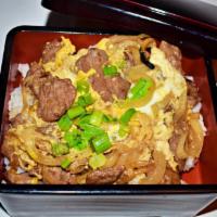 Gyu Don · Beef, onion and egg simmered with sauce over rice.