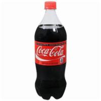 Coke Classic 1L · Crisp, delicious soft drinks flavoried with vanilla, cinnamon, and citrus.