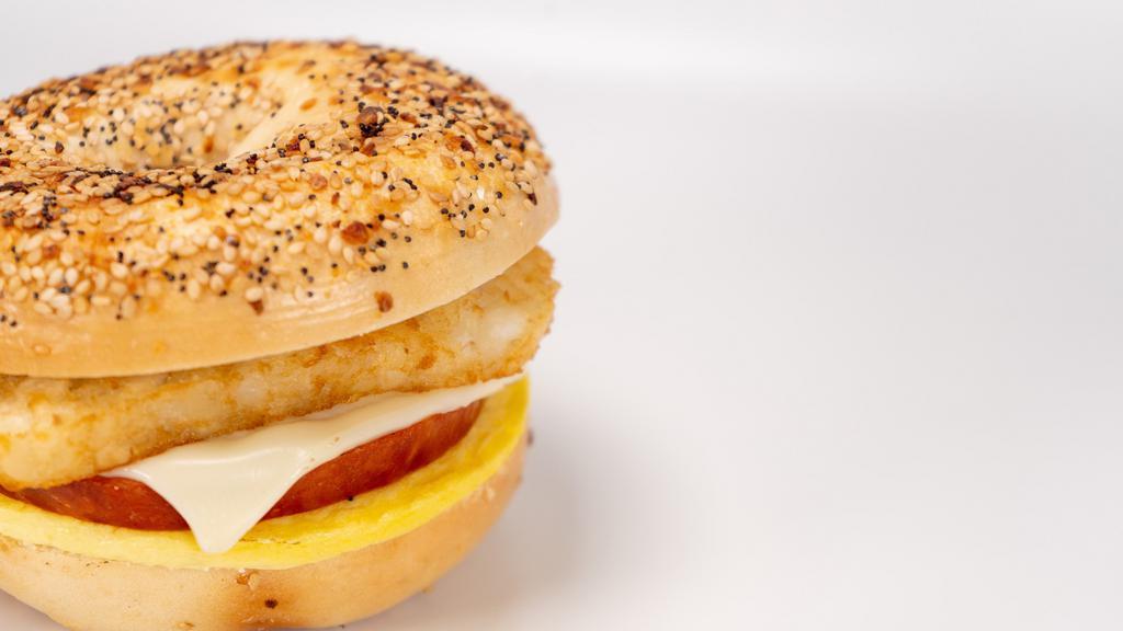 Artisan Country Sandwich · A hearty mouthwatering combination of chourico (Portuguese sausage) egg, cheese and a hash brown served on an everything bagel.