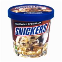 Snicker's Ice Cream Pint · Waves of luscious vanilla hugged by chunks of chewy nougat, topped with caramel, peanuts, an...