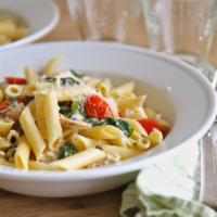 Penne Florentina · Penne pasta tossed with grilled chicken strips, spinach and mozzarella cheese, sauteed in a ...