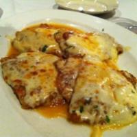 Veal Sorrentino · Pan seared veal layered with imported prosciutto, battered eggplant and homemade melted mozz...