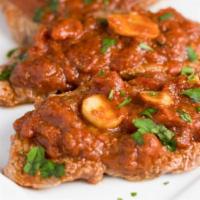 Veal Pizzaiola · Medallions of veal with peppers, onions and fresh mushrooms, sauteed in a sherry wine plum t...
