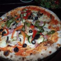 Giardino Pizza · A lightly seasoned crust baked with shredded mozzarella, topped with field greens, flame-roa...