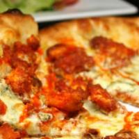 Buffalo Chicken Pizza · Chicken pieces sauteed in a combination of BBQ and hot sauces prepared on a round pizza crus...