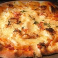 Baked Penne Pizza · Penne pasta tossed with pomodoro sauce topped with seasoned ricotta and mozzarella cheese on...