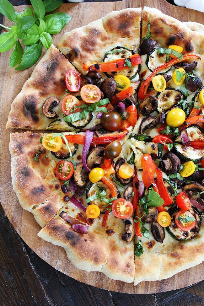 Grilled Vegetable Pizza · Grilled eggplant, zucchini and yellow squash with spring mix, sliced tomatoes, fresh mozzarella and balsamic glaze.