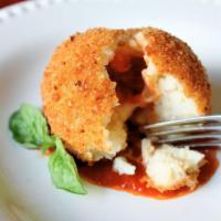 Riceball · Filled with meat sauce, peas and mozzarella cheese.