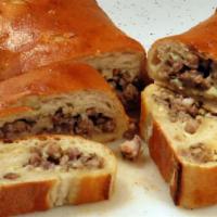 Sausage Roll · Pizza dough rolled with sauteed Italian sausage, peppers, onions, pomodoro sauce and mozzare...