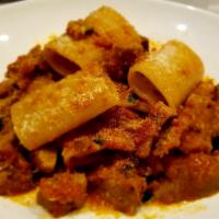 Paccheri Al Ragu Di Spuntature · Large pasta tubes, roman style spare ribs and sweet sausage ragout.