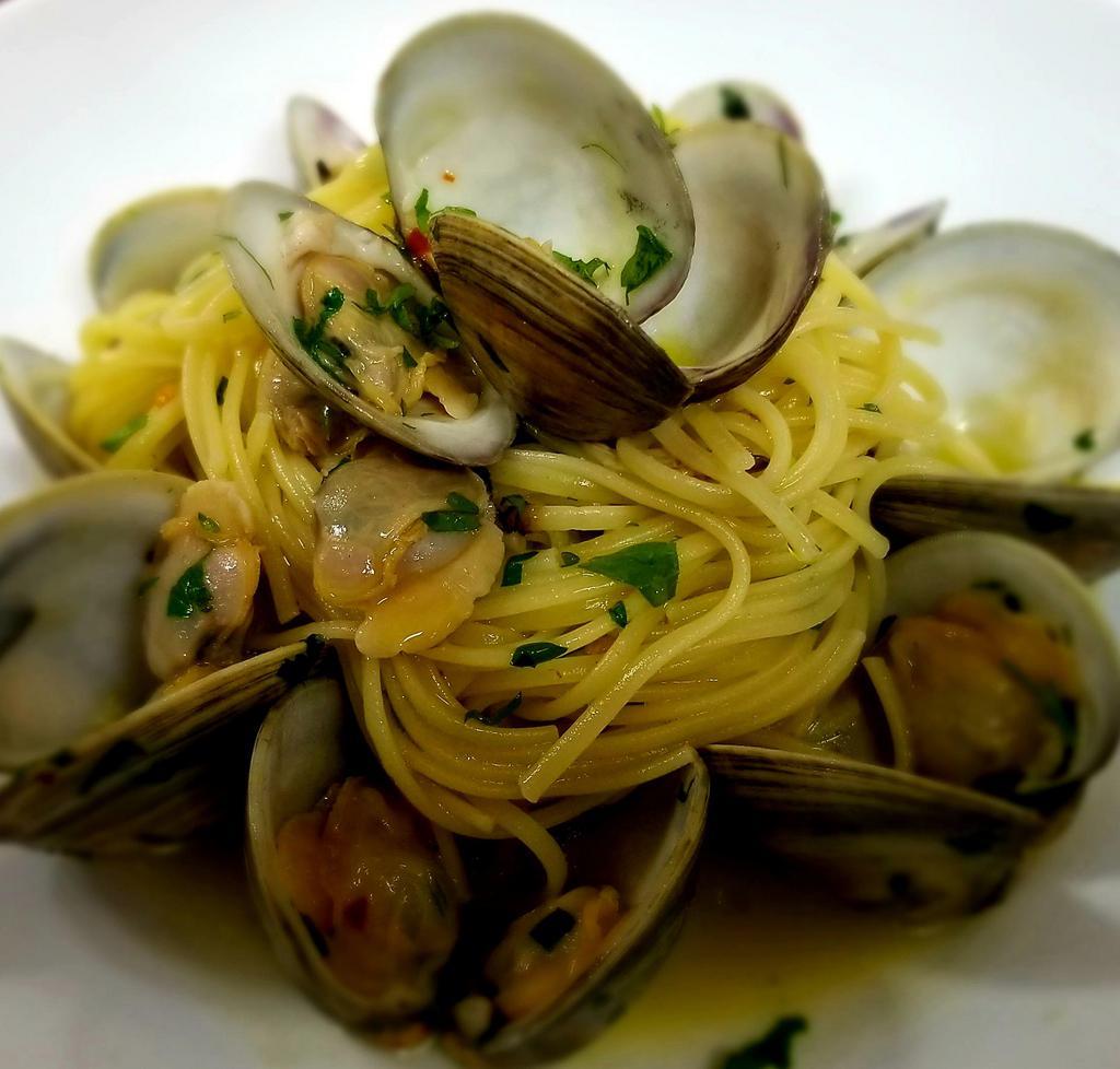 Linguine Alle Vongole · Little neck clams served over linguine garlic & oil, white wine, herbs 