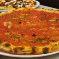 Marinara Pizza · Garlic, tomato, anchovies, oregano.