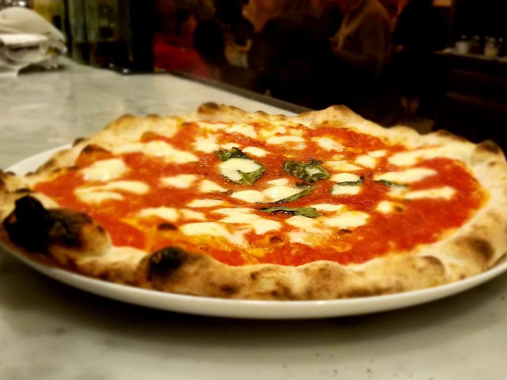 Margherita Pizza · Fior di latte, tomato, basil.