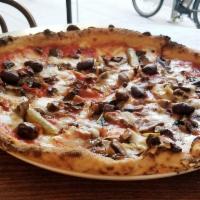 Capricciosa Pizza · Fior di latte, tomato, mushrooms, artichokes, parma ham, olives.