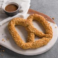 Sweet Almond Pretzel · A sweet yet salty pretzel baked fresh and topped with our own toasted almond crunch. Pair it...