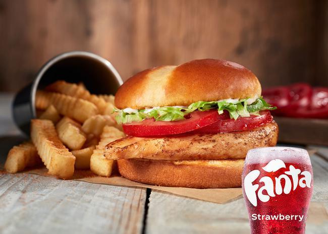 Grilled Chicken Sandwich Meal · Not living the fried life? Try this favorite with grilled chicken, mayo, tomatoes, and crisp lettuce on a toasted potato bun, served with Crinkle Fries and a small sized Coca-Cola Freestyle® drink, over 100 refreshing choices available in-store. (880-1230 Cal)