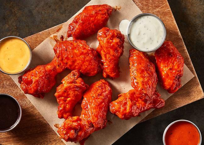 Traditional Wings - 20 · Order them to share, or to keep them all to yourself... we won't judge. Our Traditional Wings, served with Ranch Sauce, tossed in the sauce of your choice. (1910-2310 Cal)